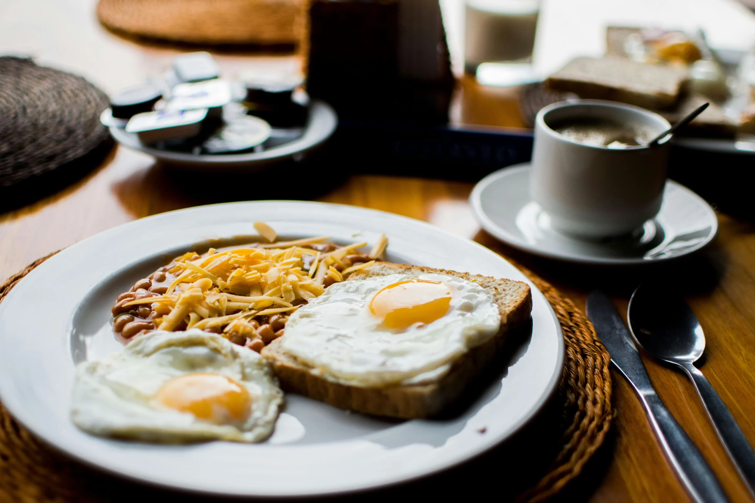 Delicious breakfast dishes including pancakes, eggs, and smoothies.