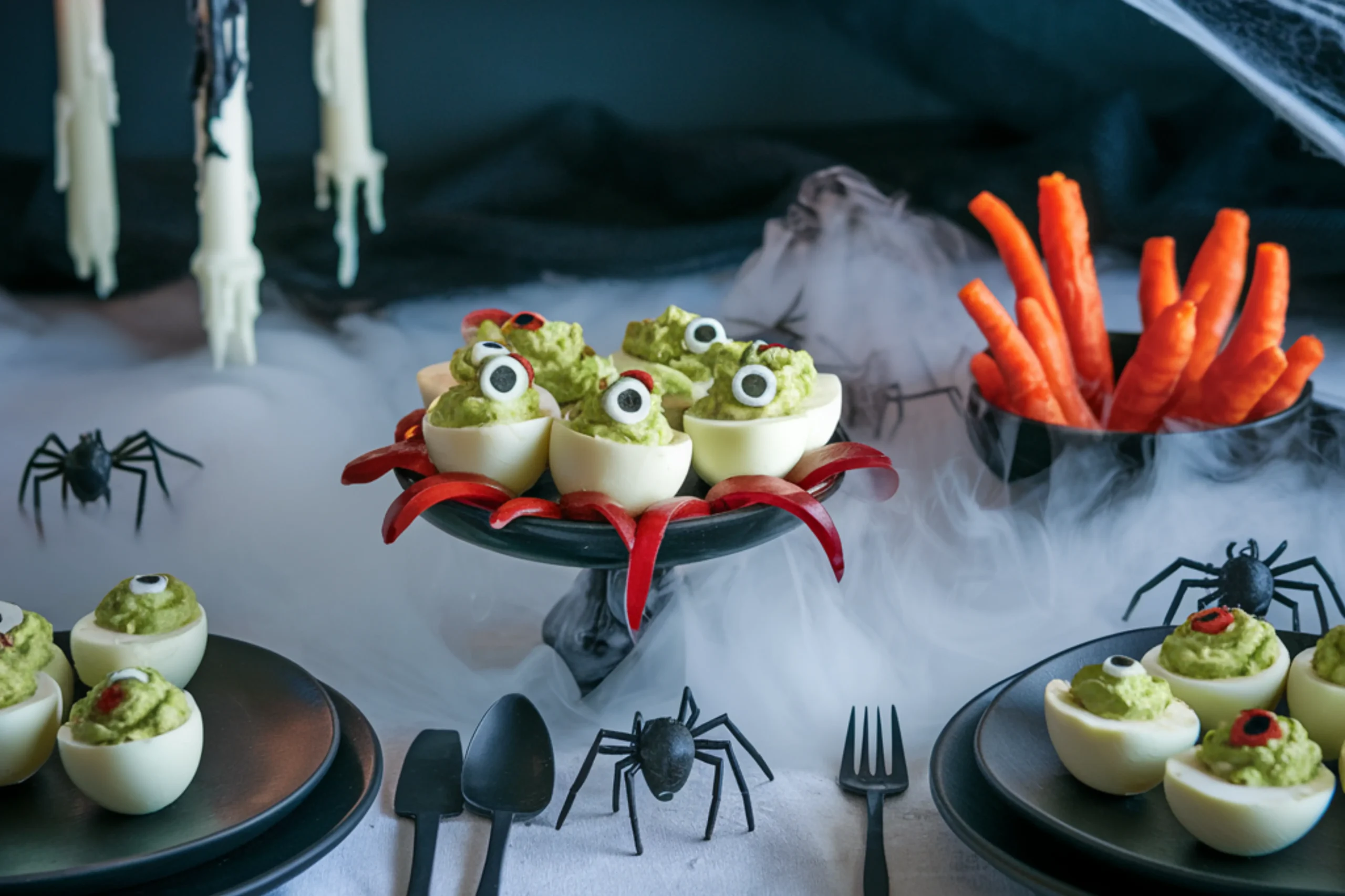 Monster Deviled Eggs - Halloween appetizers with green filling and olive eyes