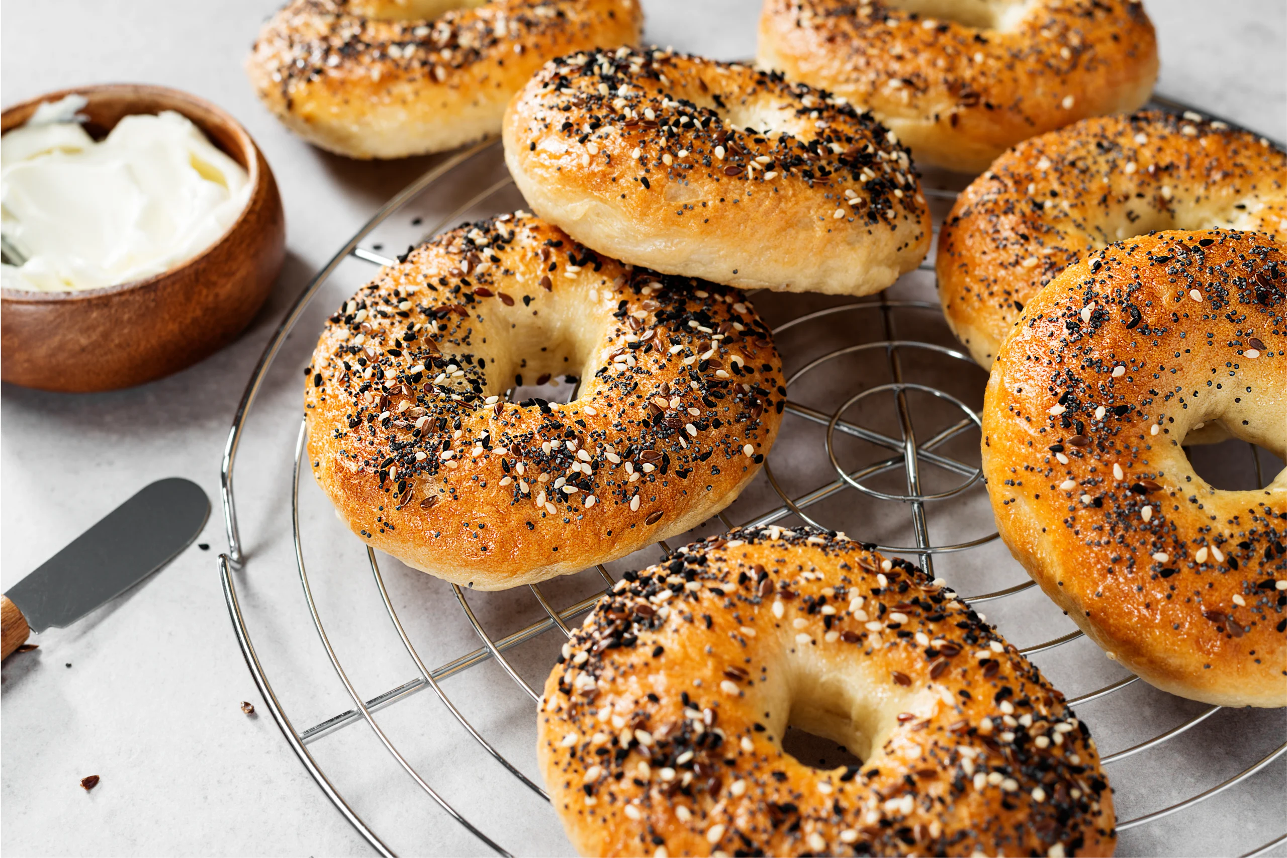 Freshly baked sourdough bagels with a golden-brown crust, part of an easy sourdough bagel recipe.